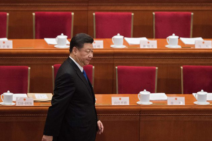 Chiński lider Xi Jinping wchodzi na czwartą sesję plenarną Ogólnochińskiego Zgromadzenia Przedstawicieli Ludowych w Wielkiej Hali Ludowej w Pekinie, Chiny, 13.03.2018 r. (Nicolas Asfouri/AFP/Getty Images)