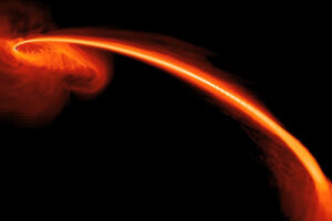 Obraz symulowany komputerowo przedstawia gaz z rozerwanej gwiazdy wpadający do czarnej dziury. Część tego gazu jest również wyrzucana z dużą prędkością w przestrzeń kosmiczną (<a href="https://www.flickr.com/people/24662369@N07">NASA Goddard Space Flight Center</a> z Greenbelt, MD, USA – <a href="https://www.flickr.com/photos/gsfc/6990020760/">Black Hole Caught Red-Handed in a Stellar Homicide</a> / <a href="https://commons.wikimedia.org/w/index.php?curid=51485189">domena publiczna</a>)