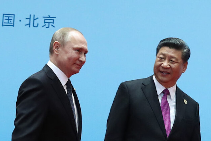 Prezydent Rosji Władimir Putin i przywódca Chin Xi Jinping podczas ceremonii powitania w ostatnim dniu Forum Pasa i Szlaku w Pekinie, 27.04.2019 r. (Valery Sharifulin/Sputnik/AFP via Getty Images)